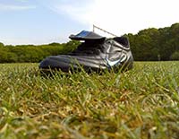 A football boot on a grass pitch. Boot on the other foot by markhillary is licensed under CC BY 2.0
